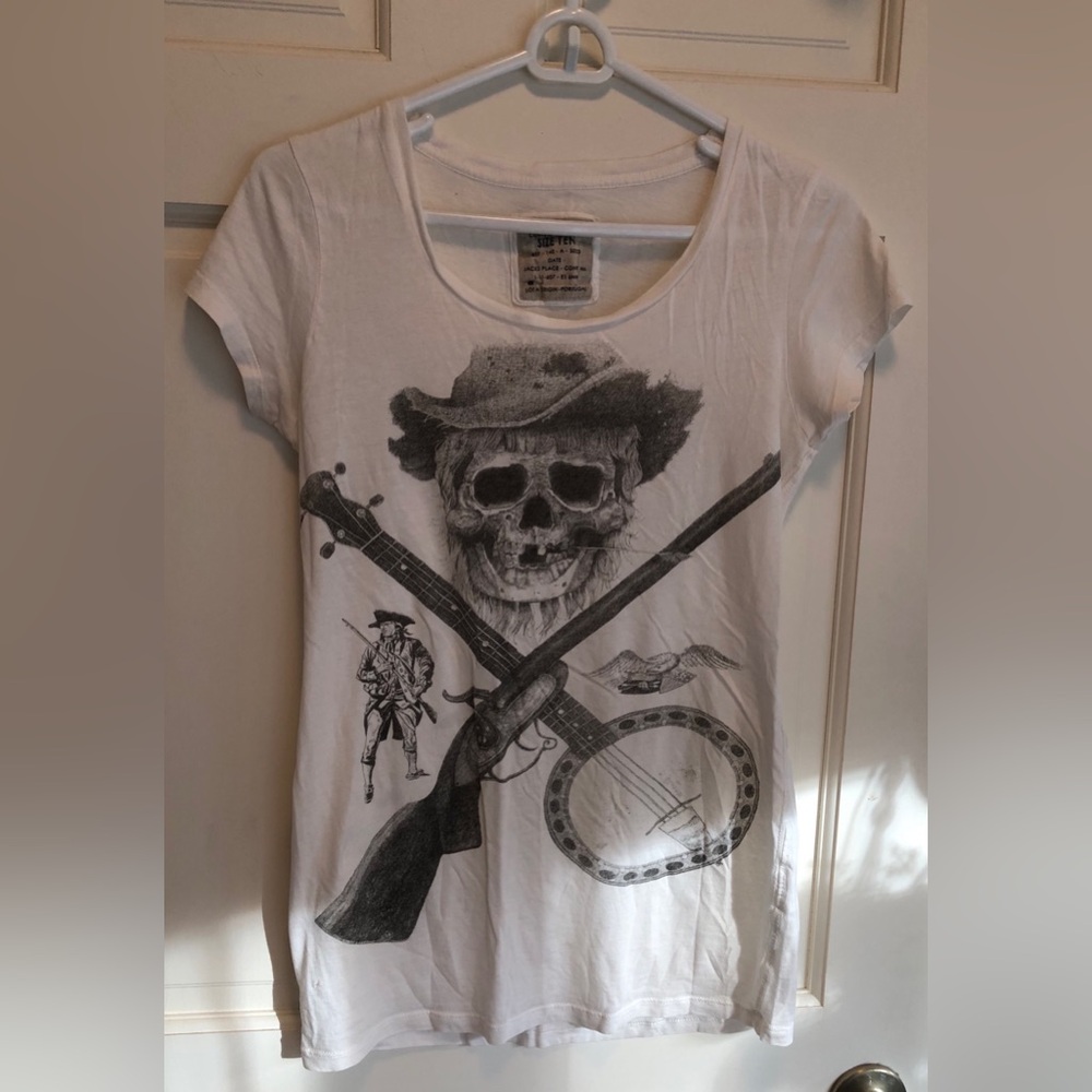 Vintage AllSaints Tee with Skull, Rifle, and Banjo Design size 10